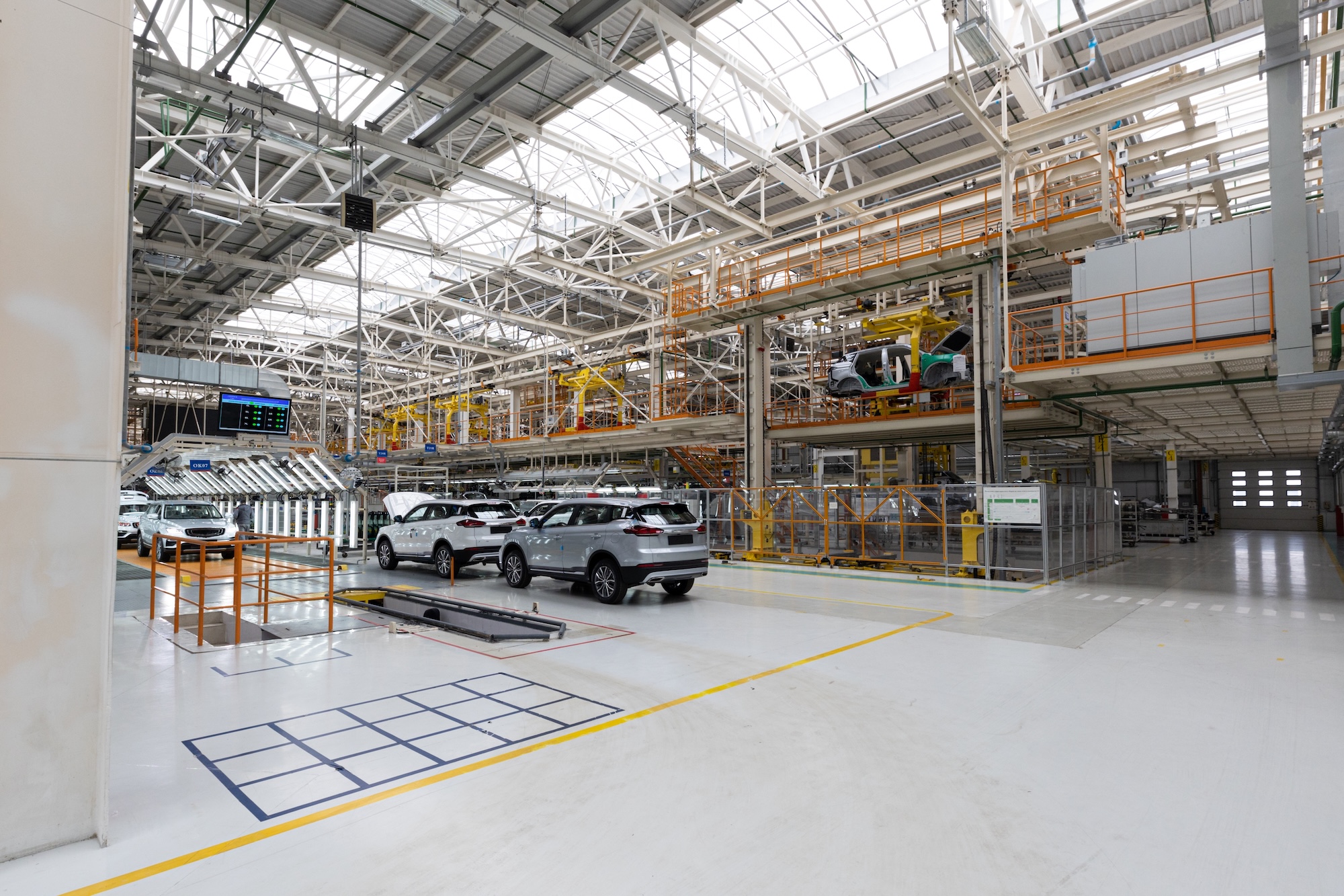 Modern automotive manufacturing facility with advanced assembly line and quality control systems. State-of-the-art automotive manufacturing facility showcasing advanced production lines, automated systems, and modern industrial operations
