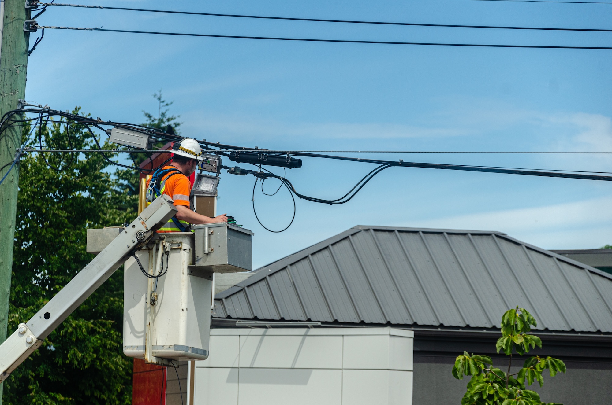 Professional field service technician working on utility infrastructure showcasing modern field operations and service management