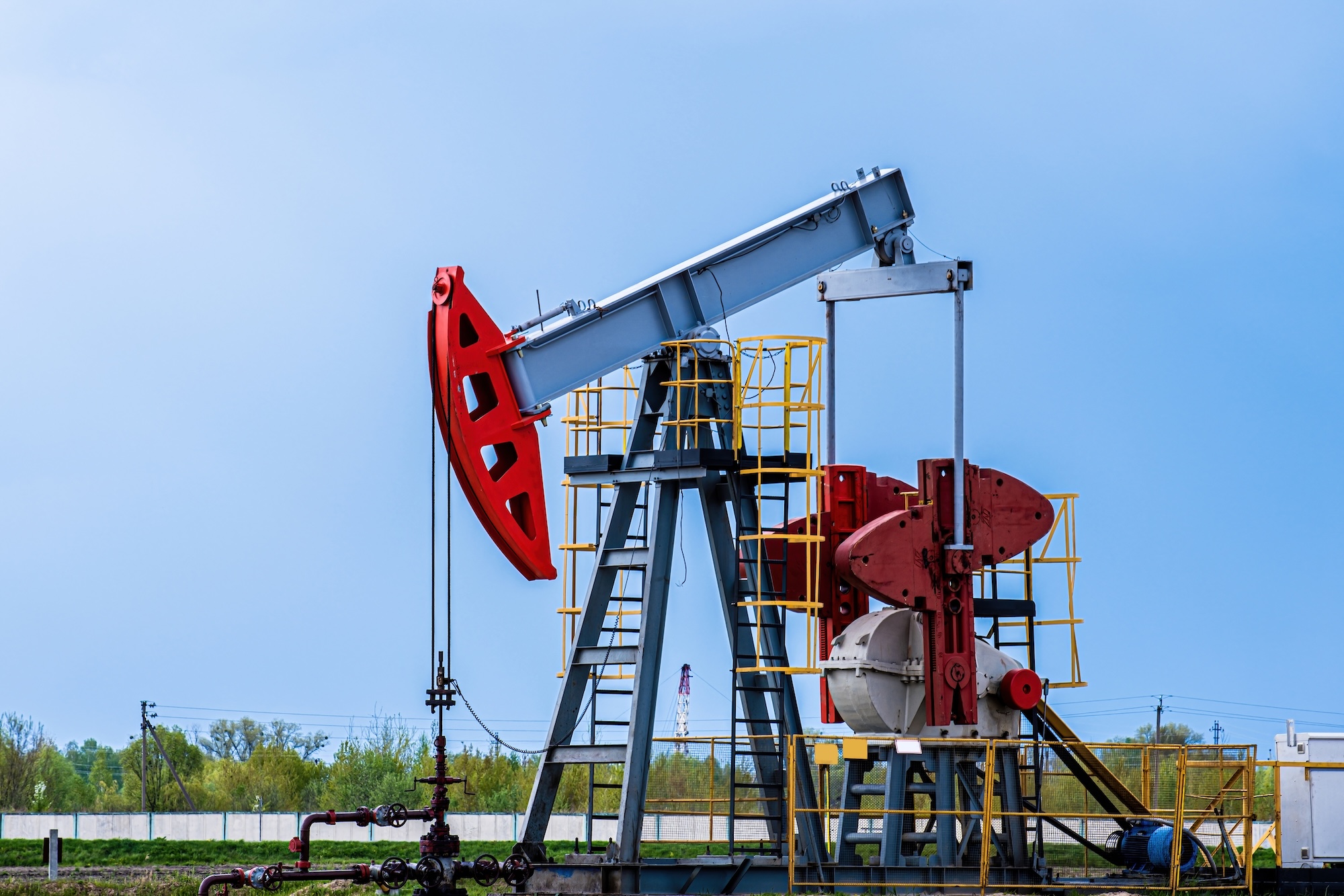 Oil and gas pumpjack used for petroleum extraction. Industrial oil and gas pumpjack equipment showcasing modern petroleum production operations and energy sector management